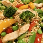In today’s fast-paced world, finding time to prepare a delicious and nutritious meal can often feel overwhelming. Fortunately, the Savory Chicken Ramen Stir Fry Delight offers a perfect solution. This dish combines the heartiness of ramen noodles with vibrant, colorful vegetables and tender, savory chicken, creating a meal that is not only quick to prepare but also incredibly satisfying.