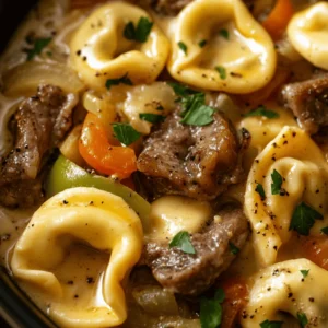 In the world of culinary arts, fusion recipes represent a thrilling intersection of flavors and traditions, where classic dishes meet innovative twists. One such mouthwatering creation is the Cheesesteak Tortellini in Rich Provolone Sauce. At first glance, this dish may seem unconventional, but it artfully combines two beloved staples: the iconic cheesesteak and the delightful, pillowy texture of tortellini. The result is a comforting and hearty meal that promises to tantalize taste buds and warm the hearts of all who indulge.